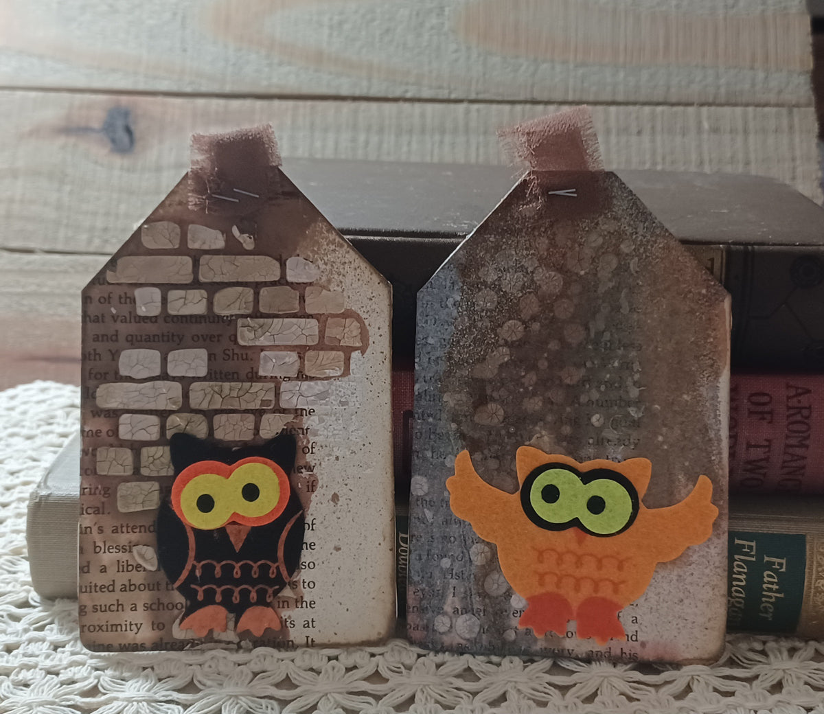 Black and orange owl journal tags layered over vintage book text with raised ivory brick and distressed wall textures