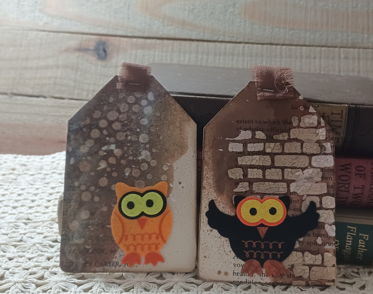 Orange and black owl tags with aged book pages, distressed neutral layers and raised cracked brick details