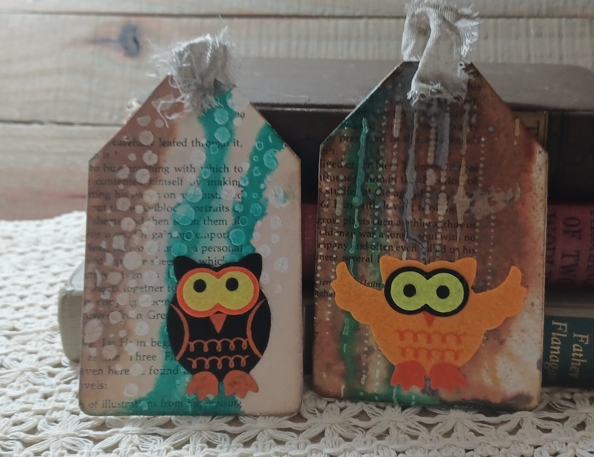 Black and orange owl journal tags with turquoise paint, rusty brown tones and aged book text