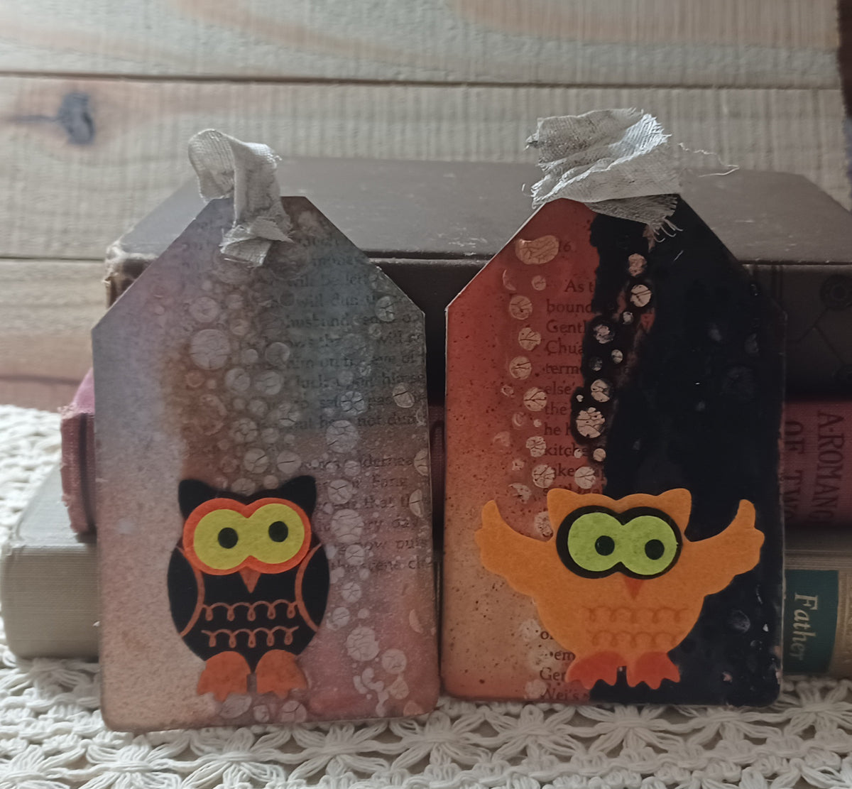Black and orange owl tags with bright green eyes, distressed book text and crackled circular texture