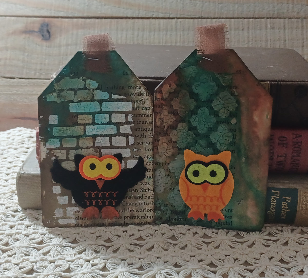 Black and orange owl journal tags layered over vintage book text with green, turquoise and ivory crackled texture