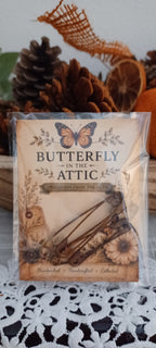 Four genuinely rusted 2-inch safety pins packaged on a Butterfly In The Attic backing card in a clear protective sleeve