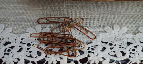 Oversized 2-inch coppery-brown paper clips packaged in a clear sleeve with a vintage-inspired Butterfly In The Attic backing card.