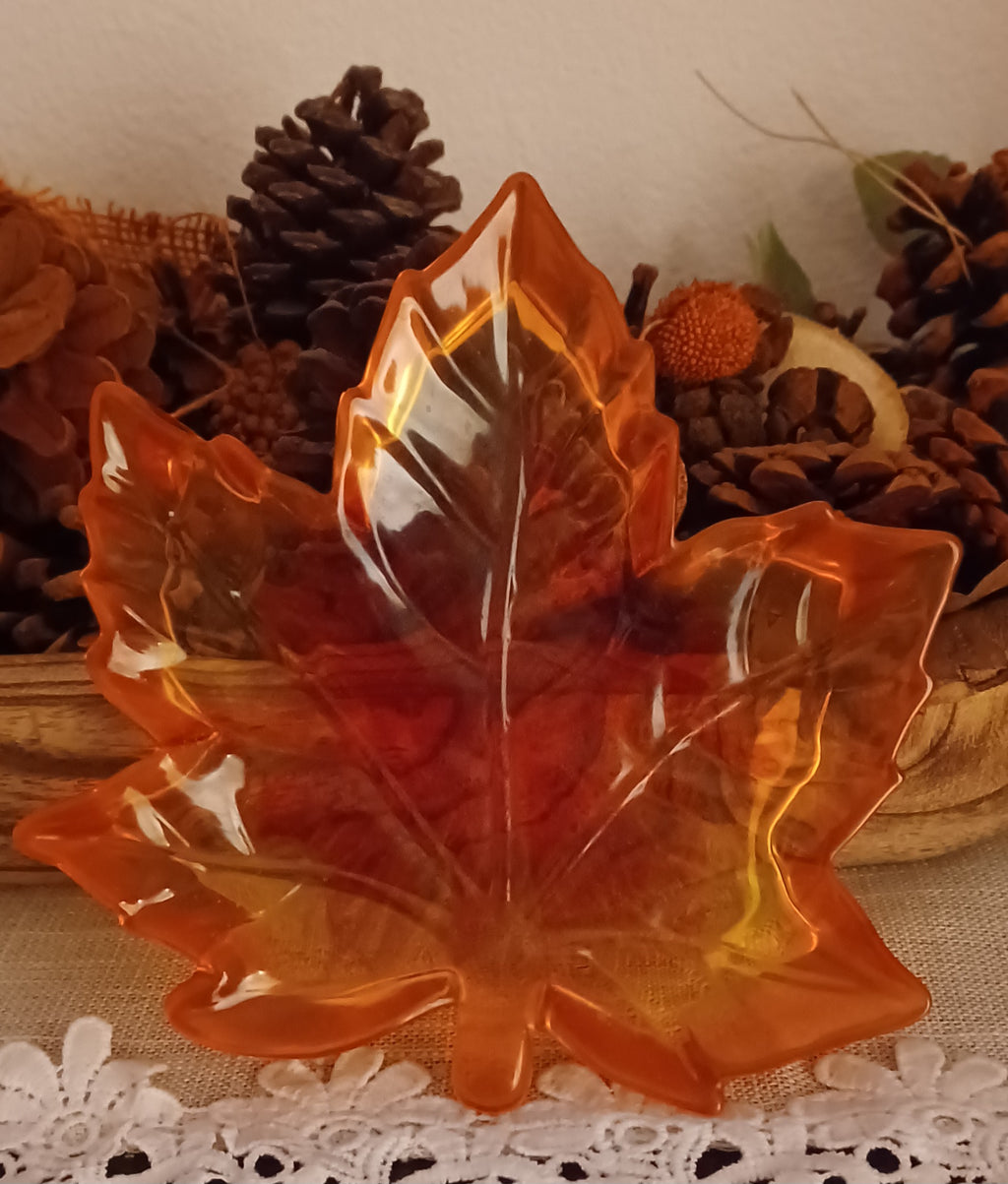 Handmade translucent resin maple leaf trinket dish in orange, red and golden autumn colors