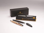 Cross ATX brushed rose gold ballpoint pen shown with representative Cross gift packaging