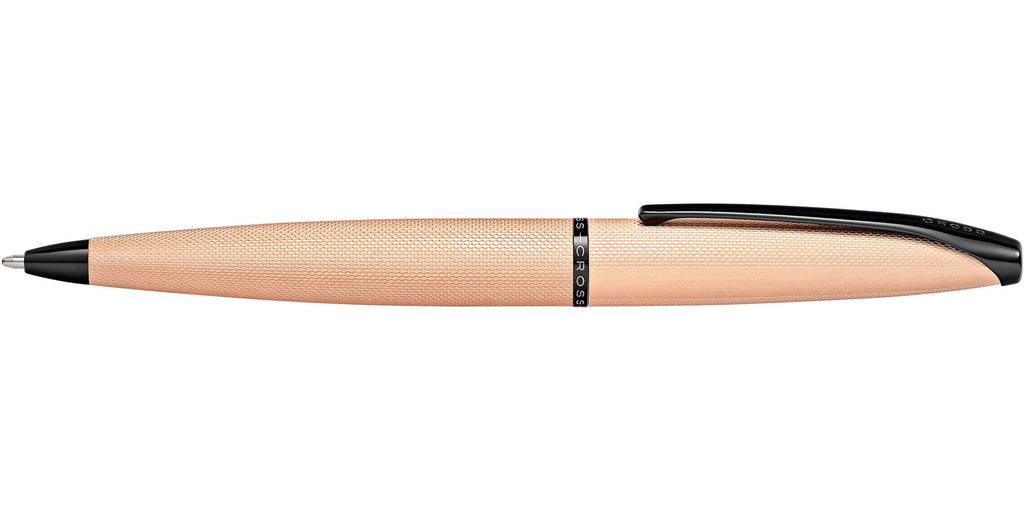 Profile view of Cross ATX brushed rose gold ballpoint pen showing black clip and tapered body