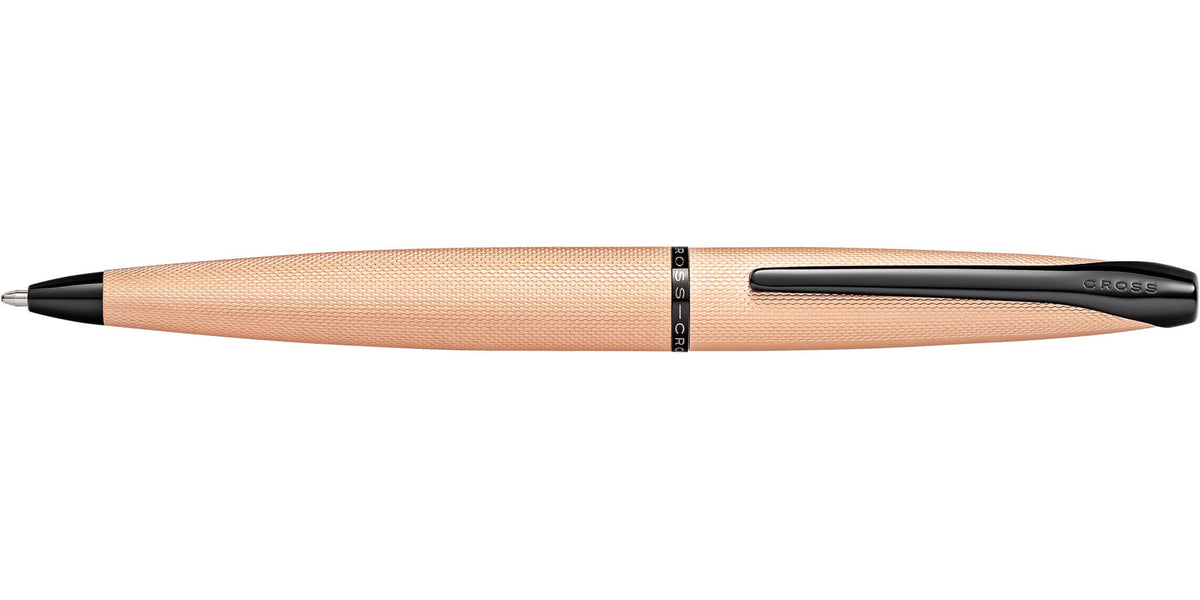 Side view of Cross ATX brushed rose gold ballpoint pen with tapered silhouette and black clip
