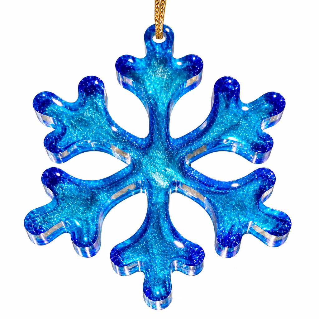 Front view of handmade blue resin snowflake Christmas ornament with shimmering turquoise and cobalt blue details and gold hanging cord on white background.