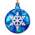 Handmade round blue resin Christmas ornament with raised white snowflake and gold hanging cord.