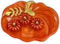 Handmade orange resin pumpkin trinket dish with gold stem and leaf detailing, accompanied by three matching miniature resin pumpkins.