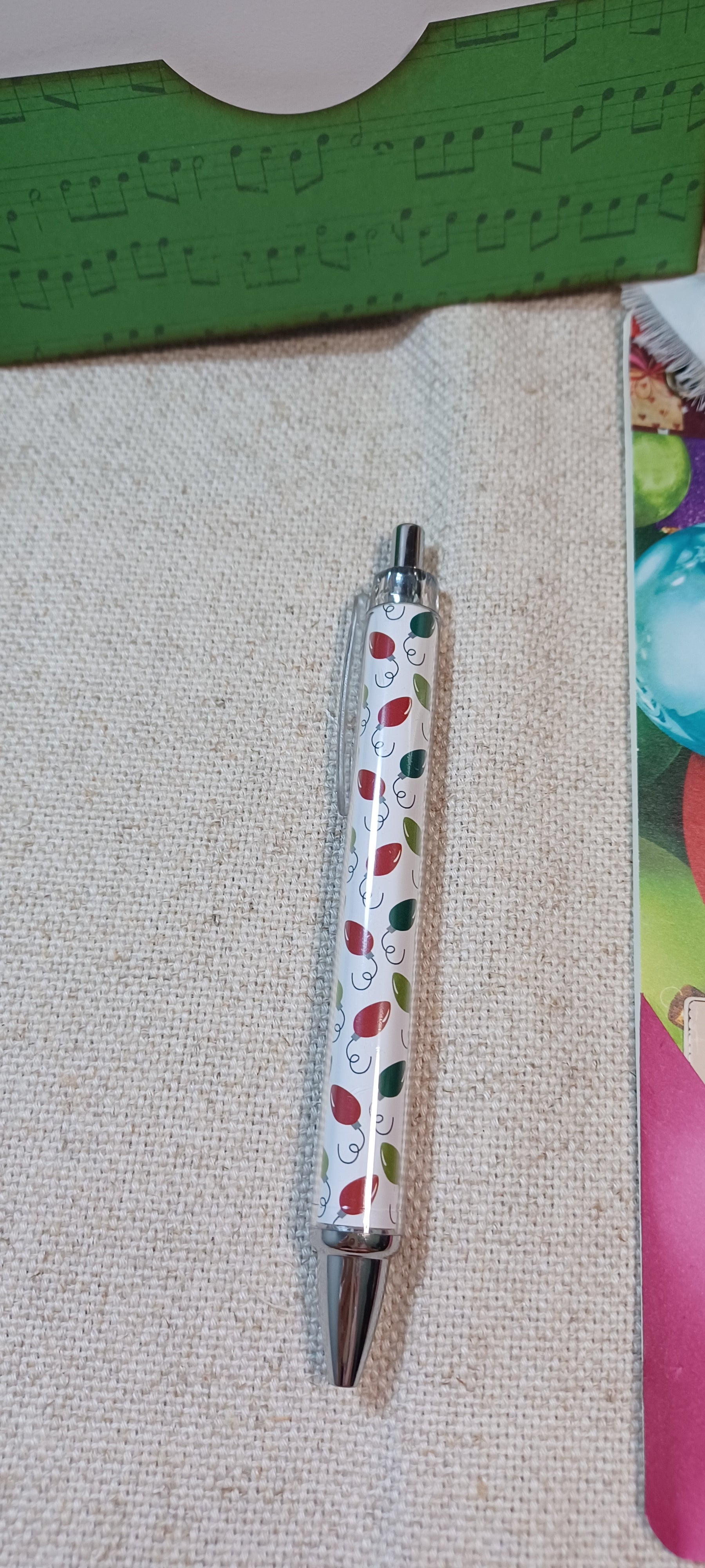 Christmas light patterned pen included with Merry & Bright mini journal writing set