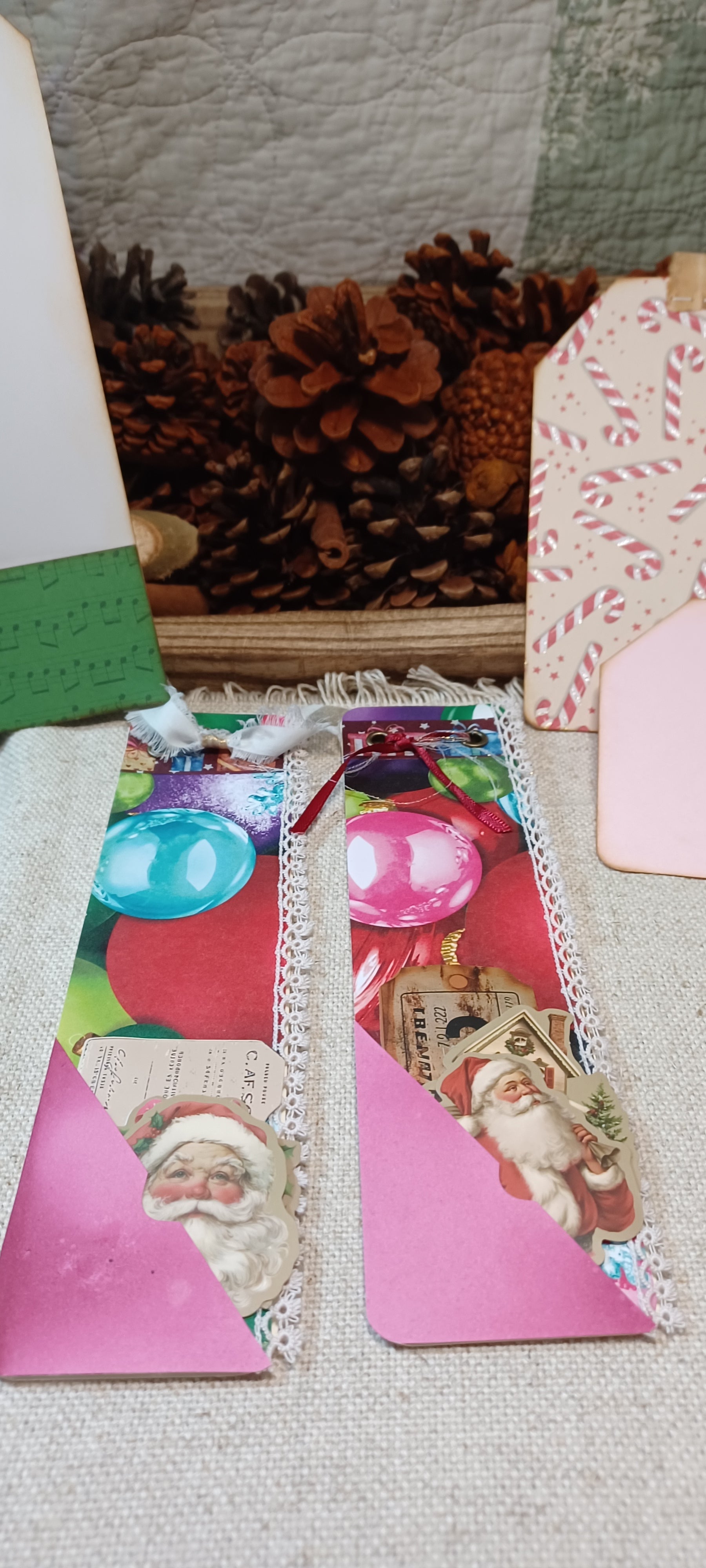 Handmade Christmas mini journals with colorful vintage ornaments, pink pockets and Santa ephemera