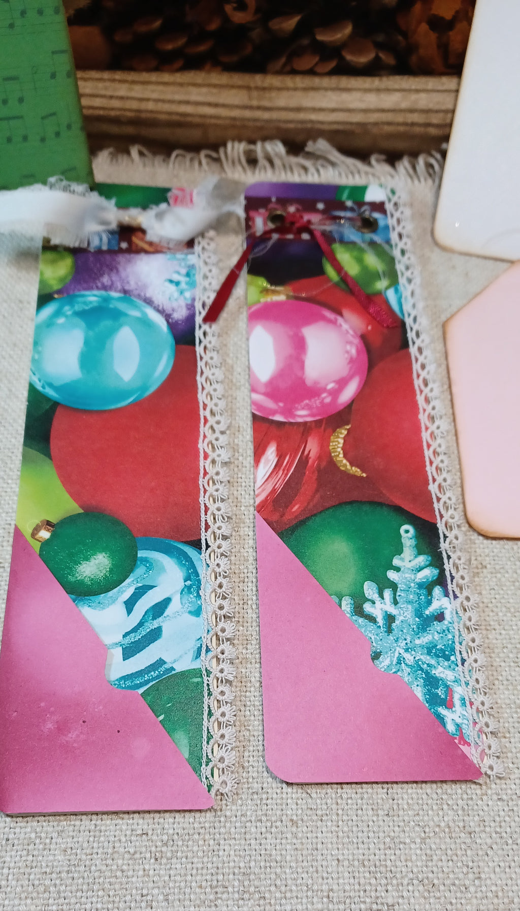 Handmade Christmas mini journals with colorful vintage ornaments, pink pockets and Santa ephemera