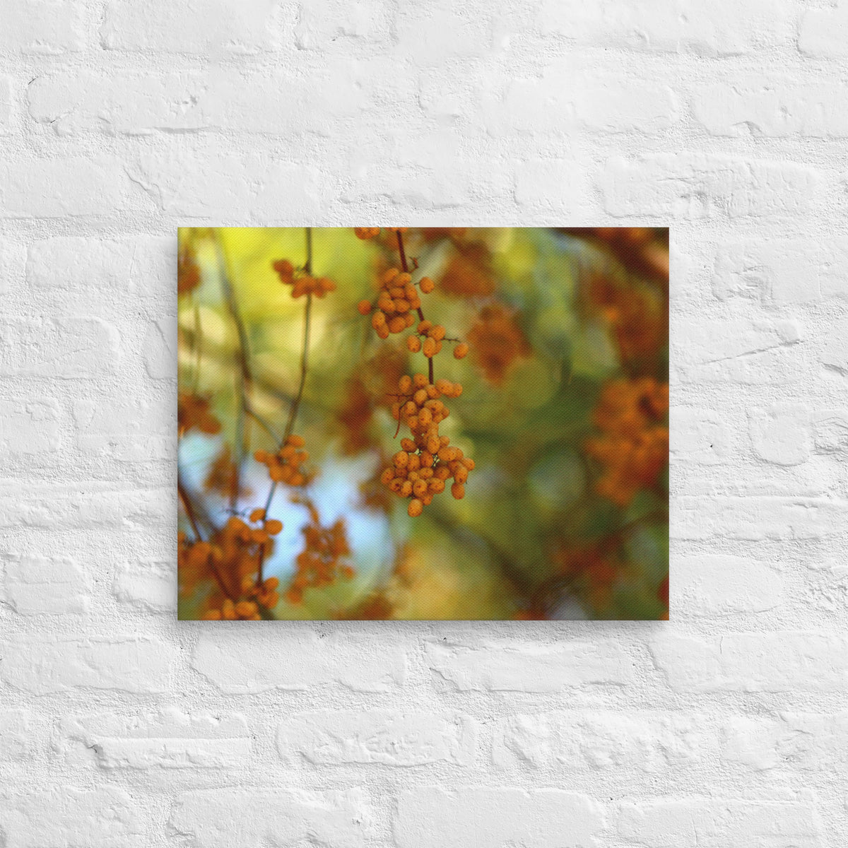 Autumn berries photography canvas shown in 16x20 on a white brick wall