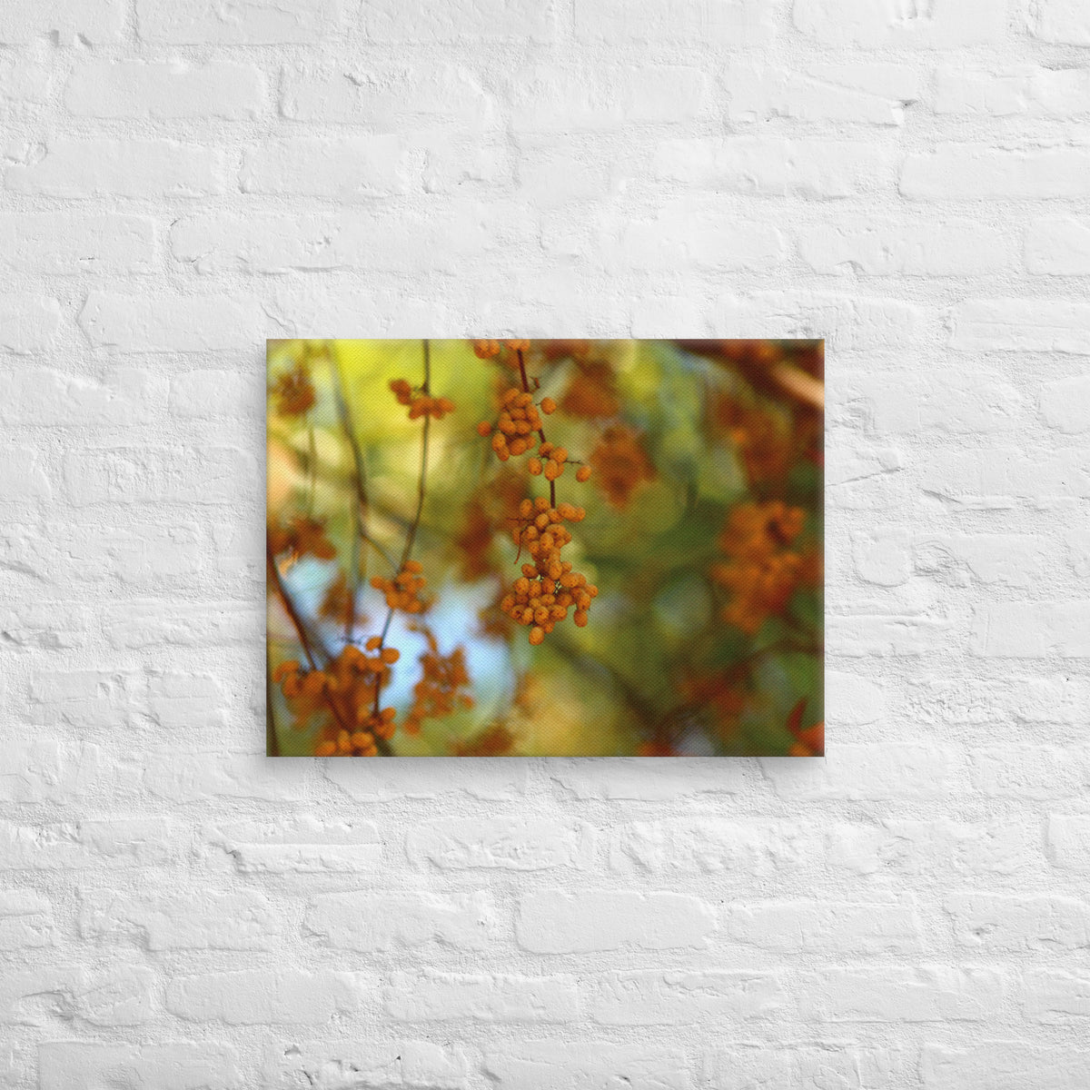 Autumn berries photography canvas shown in 18x24 on a white brick wall