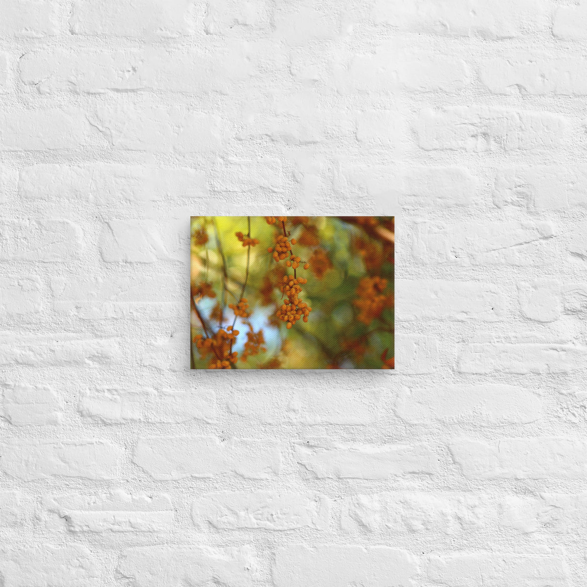 Autumn berries photography canvas shown in [9x12] on a white brick wall