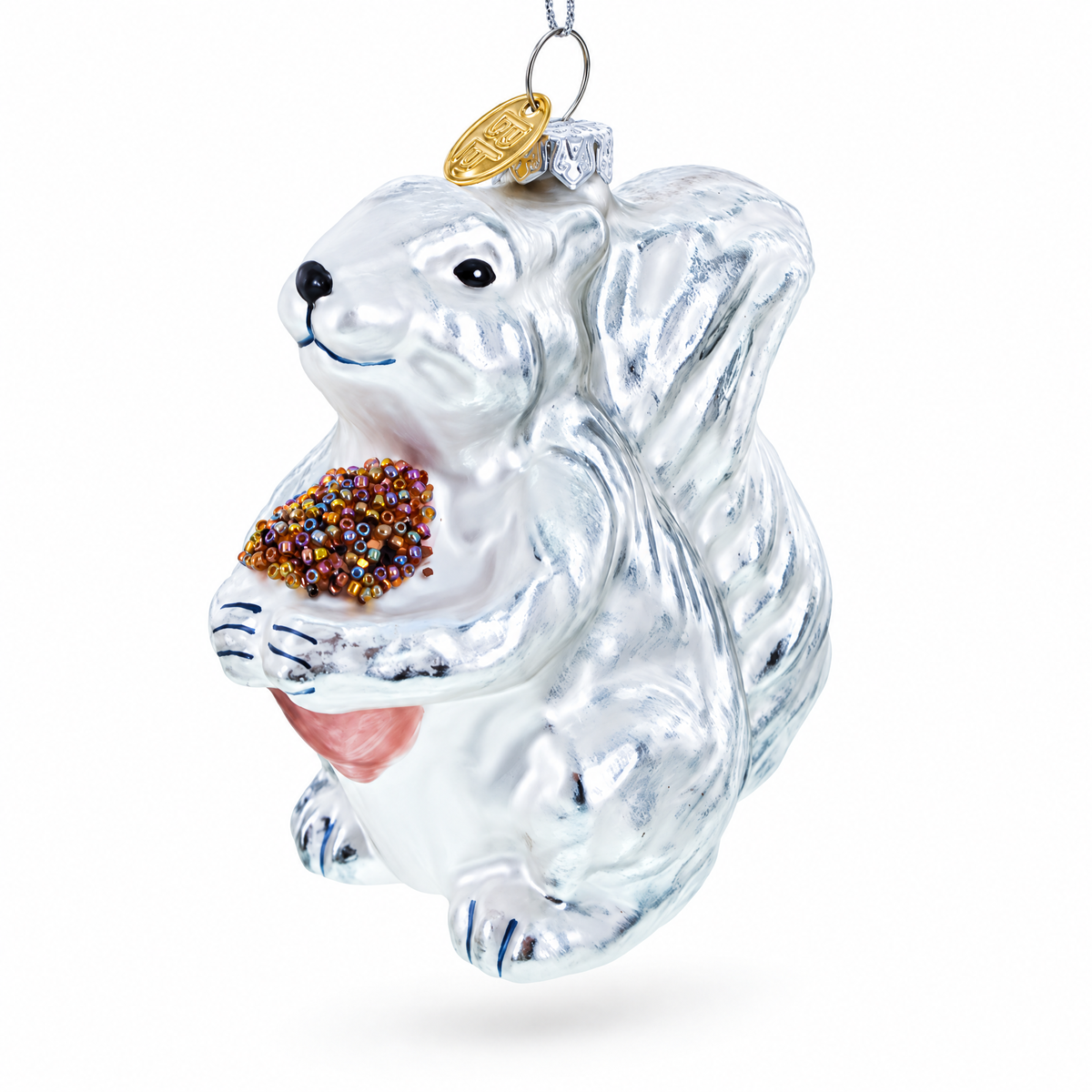 Vintage-style silver squirrel blown glass Christmas ornament holding a pinecone.