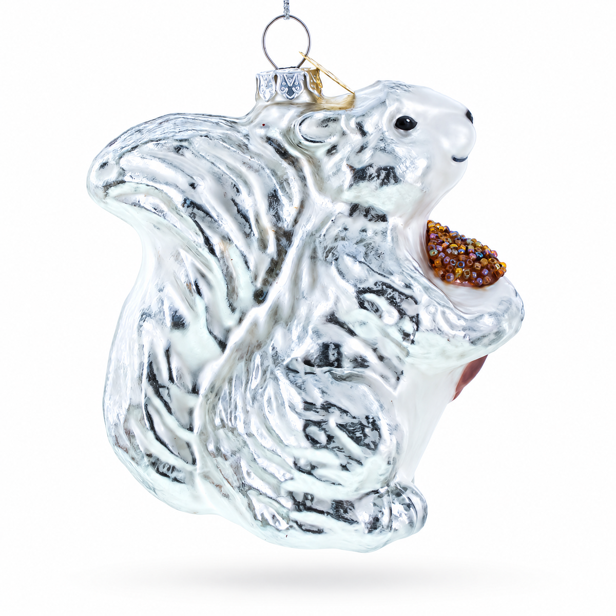 Side view of a silver squirrel glass Christmas ornament with hand-painted details and pinecone.