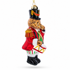 Side view of hand-painted teddy bear drummer glass Christmas ornament