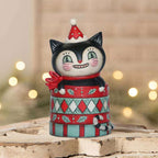 Dezzy Merry Boo black cat Christmas collectible displayed with festive holiday lights