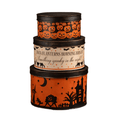 Set of three Bethany Lowe vintage-inspired Halloween nesting tins stacked together, featuring orange-and-black patterns and nostalgic Halloween illustrations.