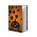 Orange hardcover matte journal featuring original black jack-o’-lantern Halloween artwork.