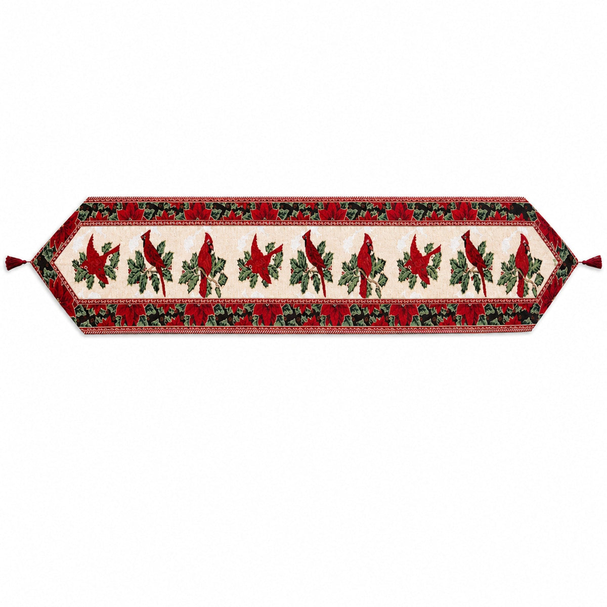 A festive table runner with a red and green holiday pattern featuring cardinal birds, holly leaves, and roses on a cream background, finished with red tassels on both ends.