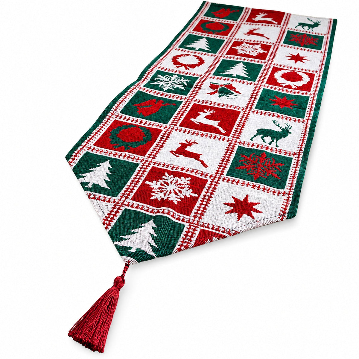 A festive Christmas table runner with a red and green checkered pattern featuring holiday motifs like snowflakes, trees, stars, and reindeer, finished with a red tassel.