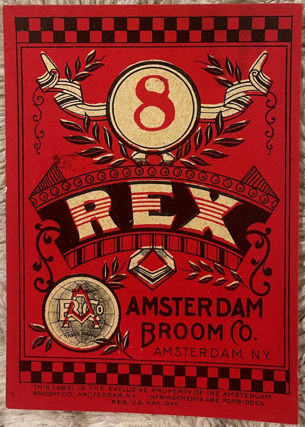 Antique Rex #8 broom label with red background, decorative number 8, and Amsterdam Broom Company lettering