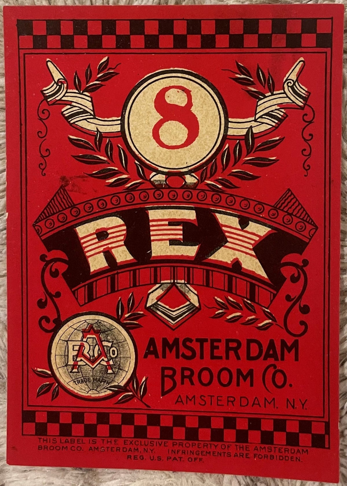 Antique Rex #8 broom label with red background, decorative number 8, and Amsterdam Broom Company lettering