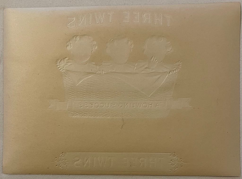 Reverse side of antique Three Twins cigar box label showing the back of the vintage paper