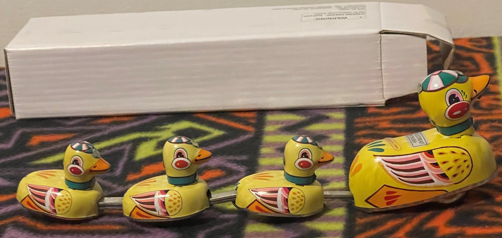 Side view of the vintage clockwork mother duck and ducklings