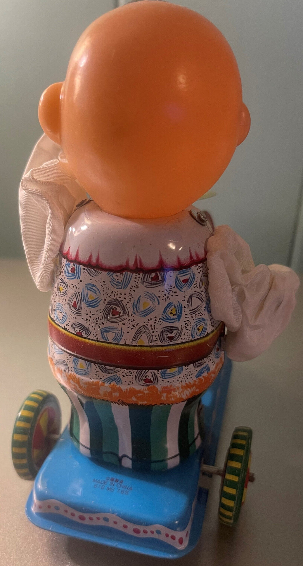 Back view of the vintage tin boy drummer clockwork toy