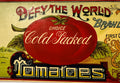 Large red tomato and vintage typography on antique Defy The World can label