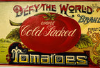 Large red tomato and vintage typography on antique Defy The World can label