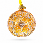 Reverse view of golden glass ball ornament with hand-painted white lily design
