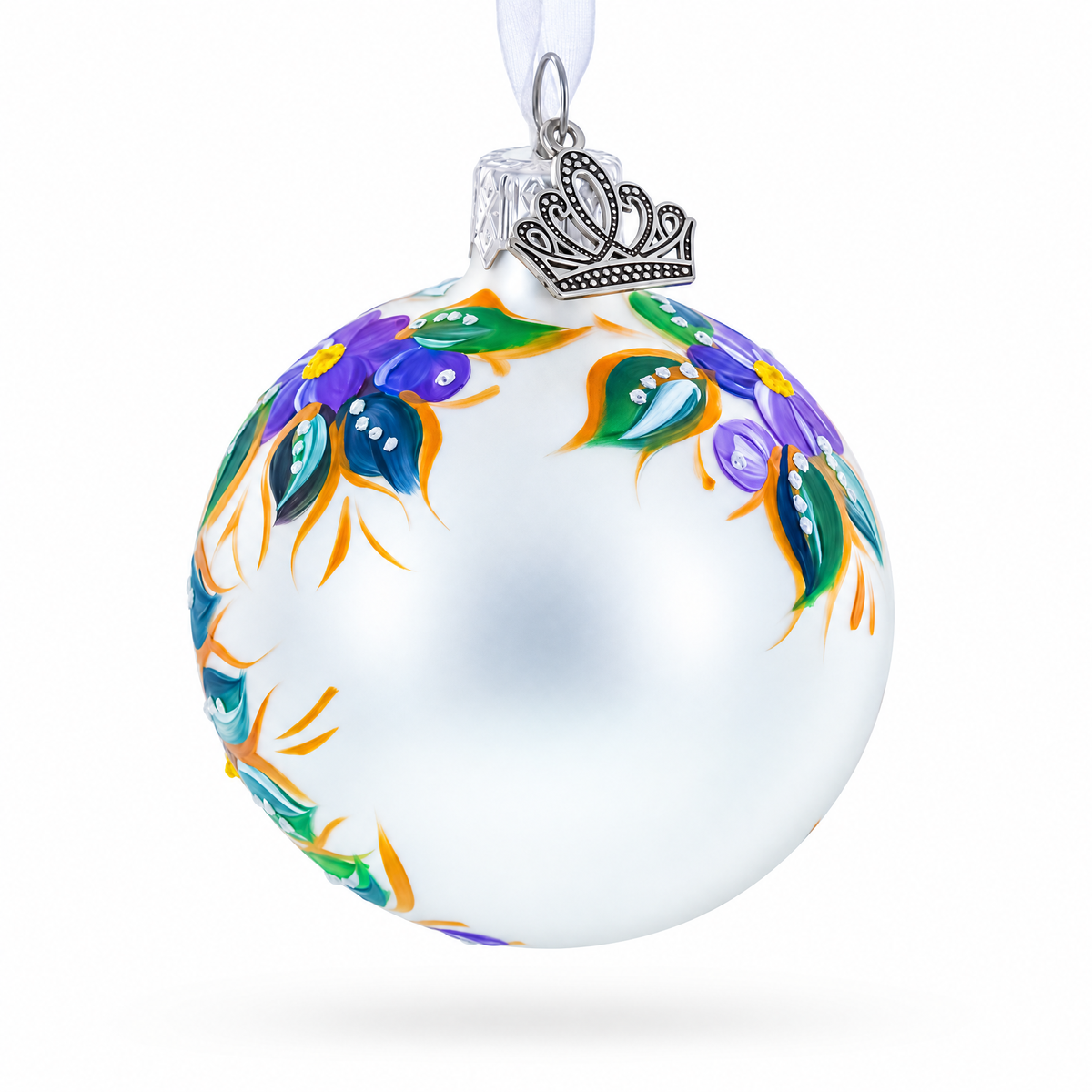 Side view of folk art glass Christmas ornament showing colorful floral and botanical painting