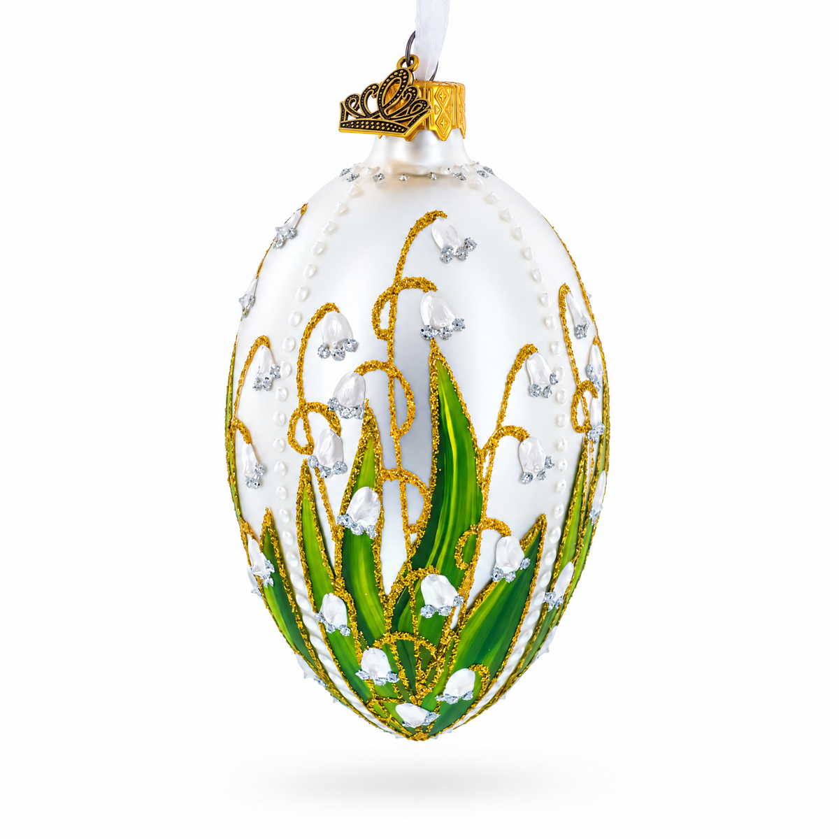 Lily of the valley glass egg ornament with white flowers, green leaves and gold detailing
