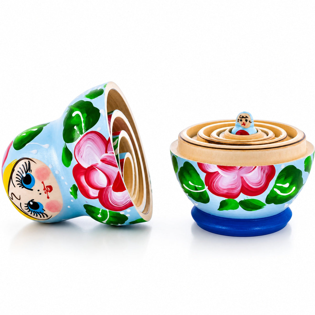 Light blue floral wooden nesting dolls opened to show the five hand-painted dolls nested inside one another
