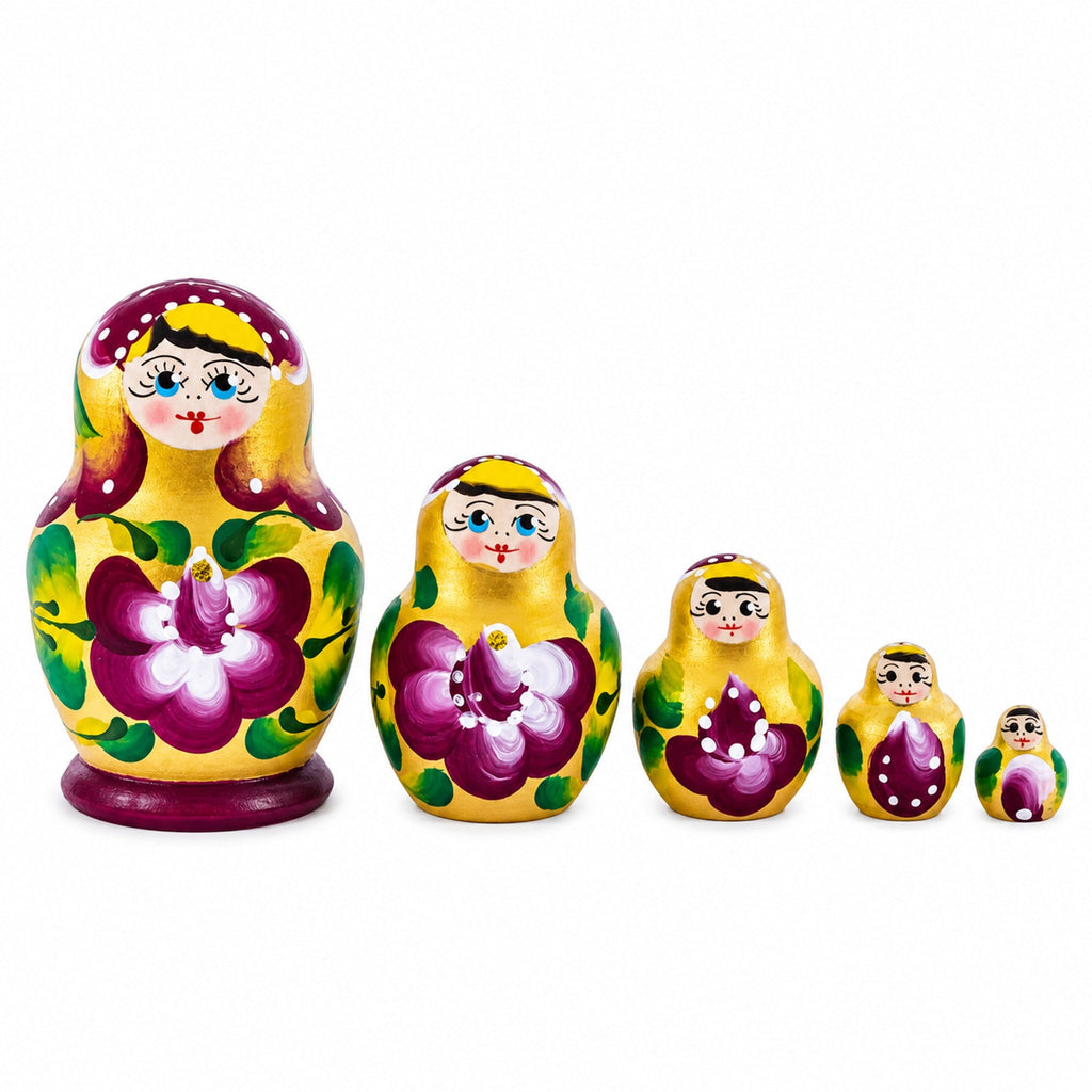 Gold and violet hand-painted wooden nesting dolls, set of five