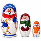 Set of three hand-painted wooden snowman Christmas nesting dolls made in Ukraine
