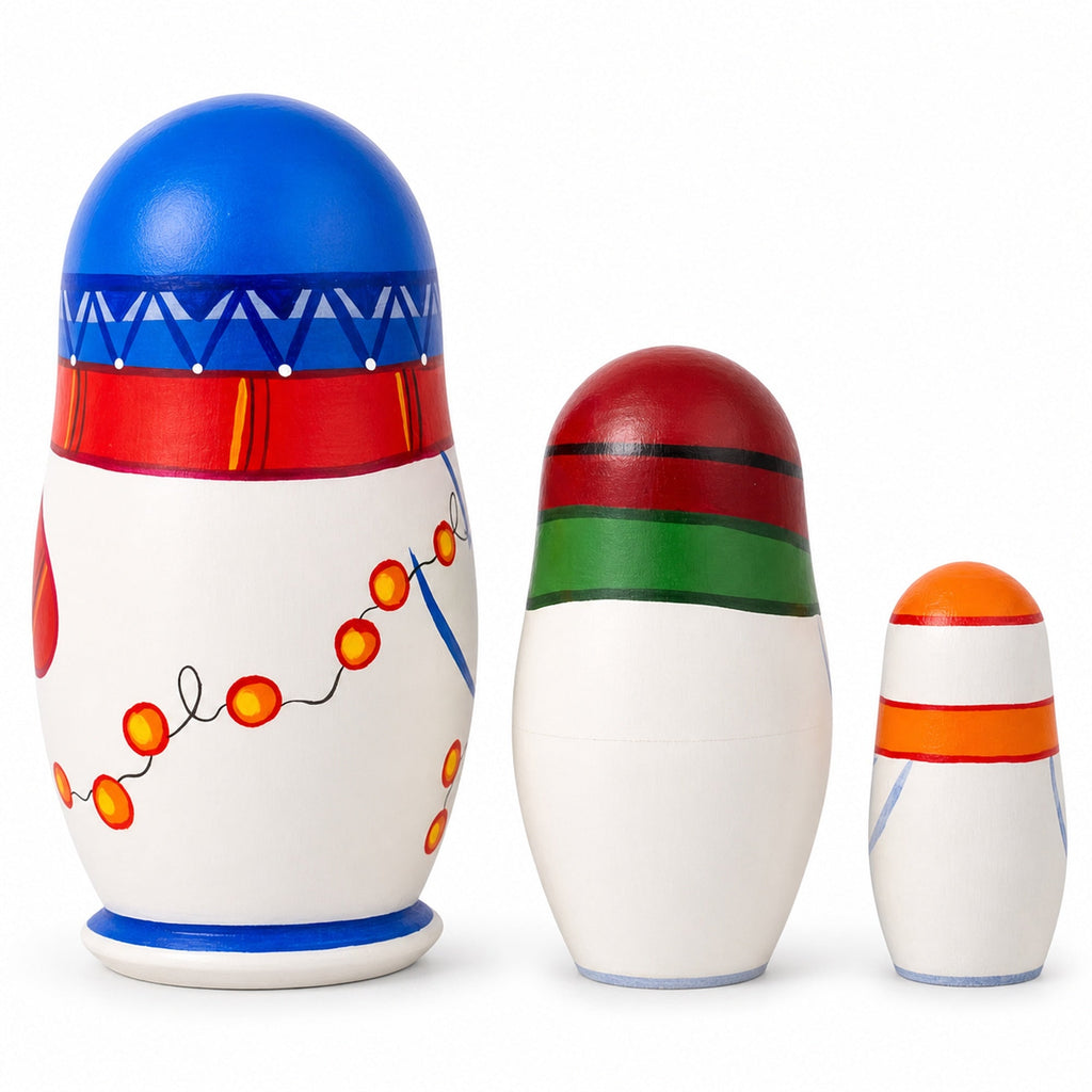 Three snowman nesting dolls opened and displayed from largest to smallest