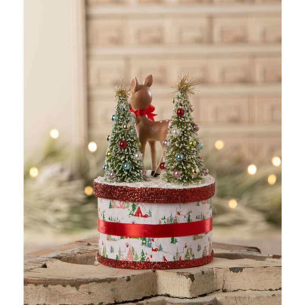 Retro Rudy Christmas collectible showing reindeer and decorated bottle brush trees