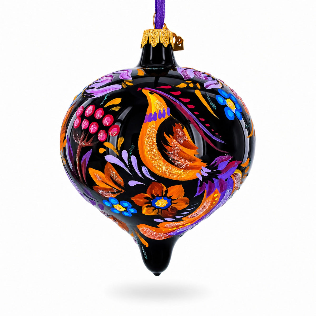 Black onion-shaped glass Christmas ornament hand painted with a colorful folk-art bird, flowers, and leaves.