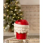 Tall Santa papier-mache Christmas bucket displayed beside a glowing Christmas tree
