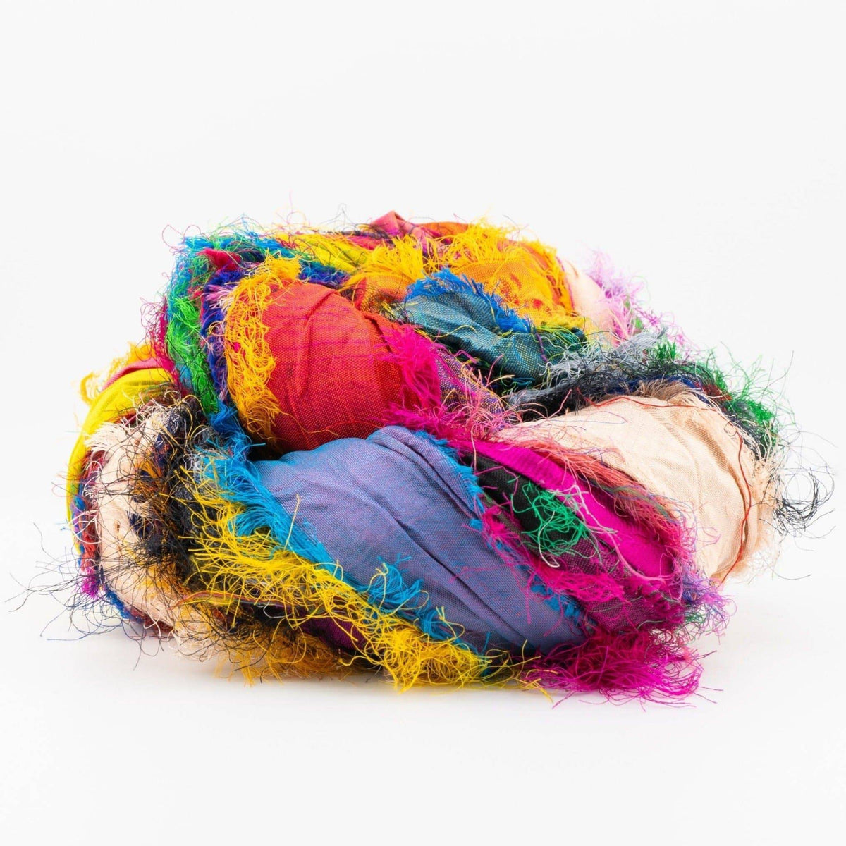 Tibet Jewels recycled sari silk ribbon skein showing bright jewel tones, soft fabric strips and frayed fibers