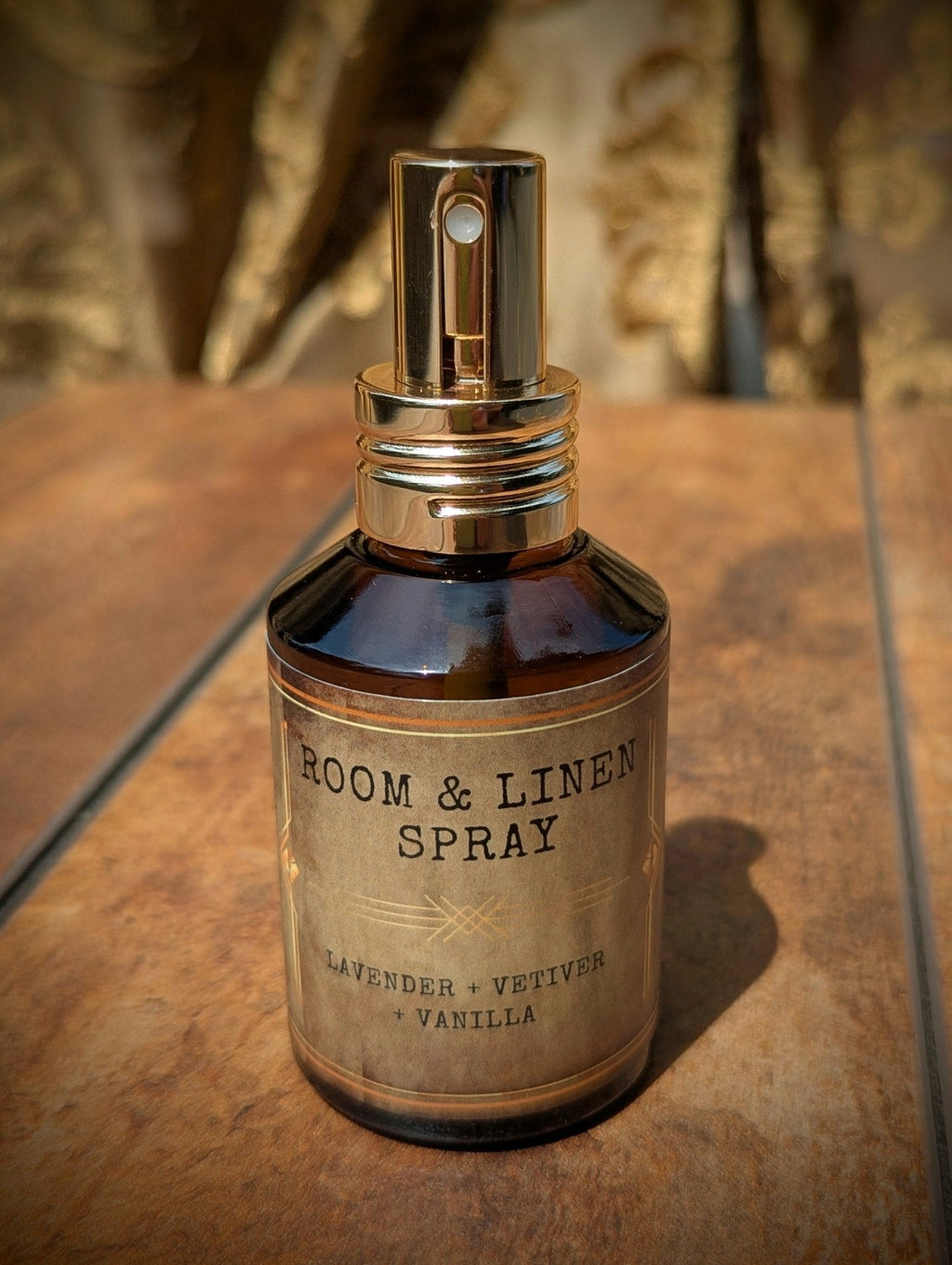 Lavender vetiver and vanilla room and linen spray in amber glass bottle