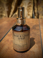 Lavender vetiver and vanilla room and linen spray in amber glass bottle